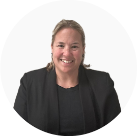 Lizel Jacobs - EthiQal Professional headshot: smiling woman in a black blazer against a white background, looking at the camera.